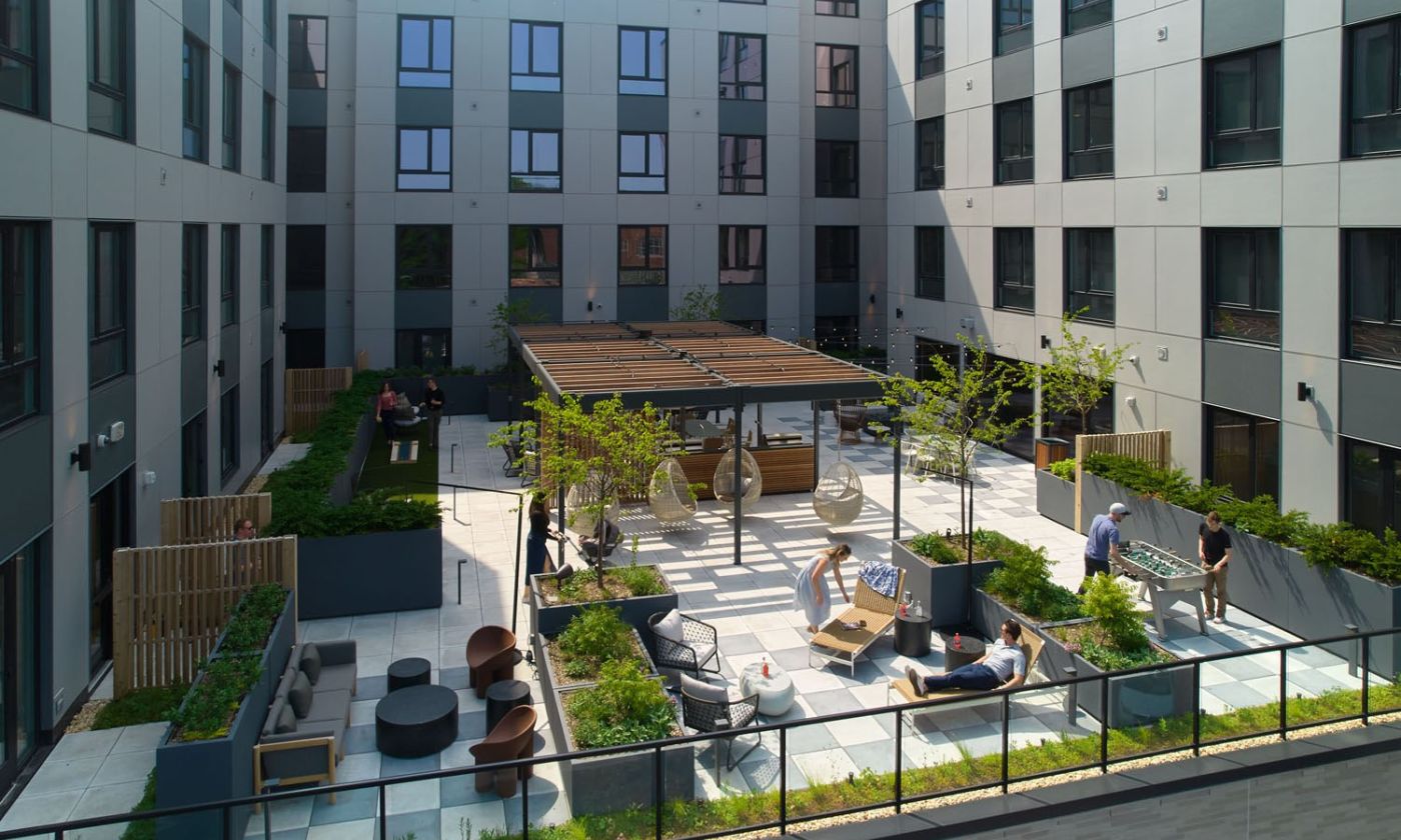 Outdoor terrace with seating, grills and firepit