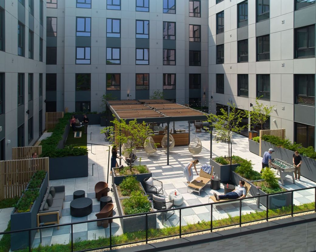 Outdoor terrace with seating, grills and firepit