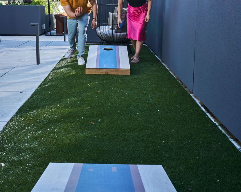 Play a game of cornhole for some friendly competition