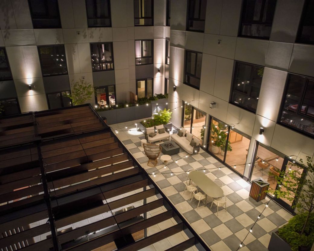 Outdoor terrace lit by string lights